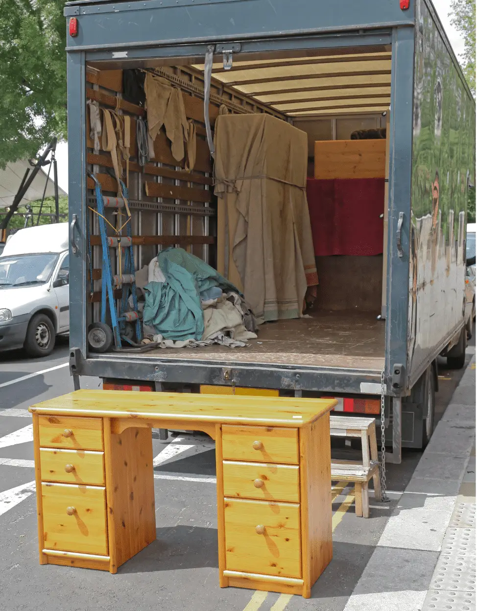 EZ-Haulin' team removing unwanted furniture from a home and loading it onto a truck for proper disposal or donation.